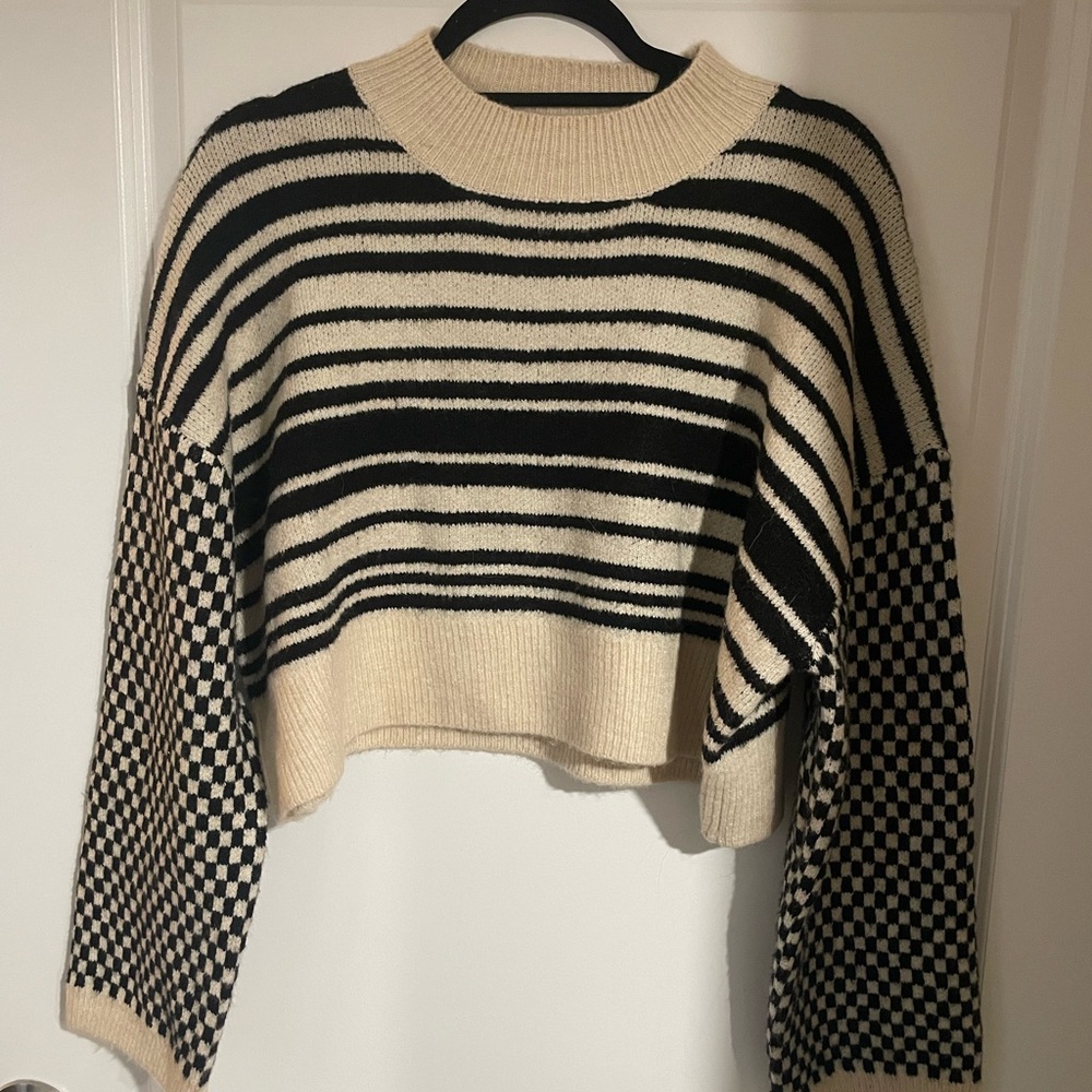 Elegant Black and Cream Striped Sweater